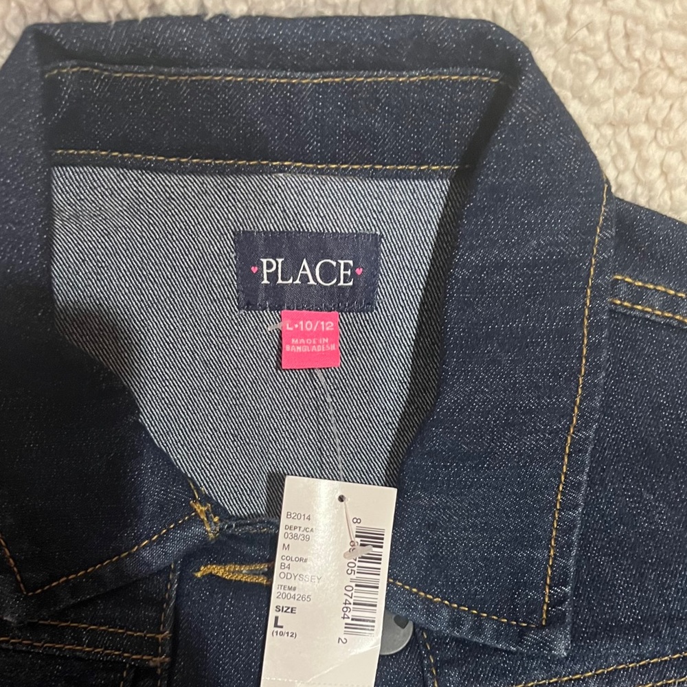 New, never worn, children’s large Jean jacket